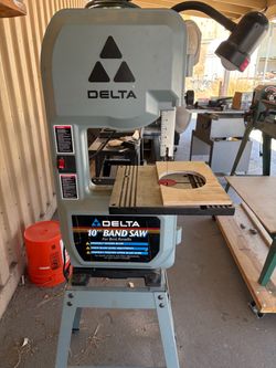Like new Delta 10” Band saw with two  new blades