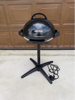 George Foreman Indoor/Outdoor Electric Grill in black with a removable stand. New, no box