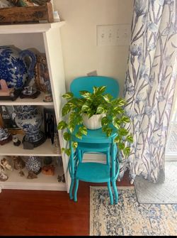 Charming turquoise metal step stool chair with a vintage look. Measures 35 inches tall with a 14 × 11-inch seat. A lovely accent piece for displaying