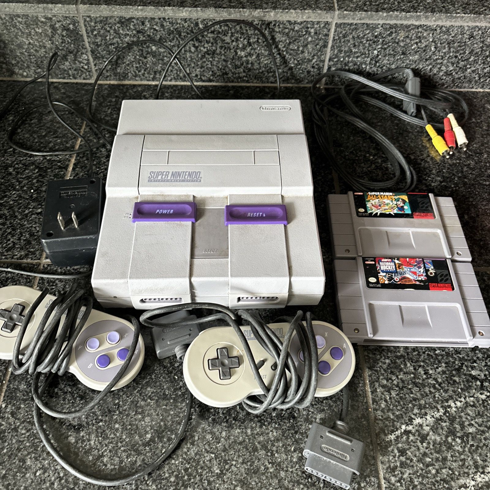 Super Nintendo system with two controllers And Accessorie And 2  games