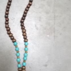 Wood Beaded Metal Turquoise Crossed With Leather Tassel