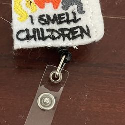 I Smell Children Badge Reel