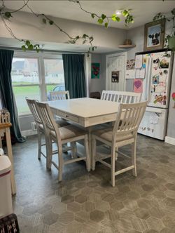 Cardi's furniture counter height dining set - table with four chairs and a bench