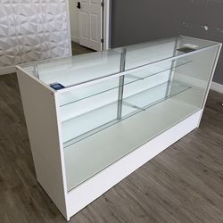 Glass display case with sliding doors