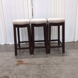 Set of Three Linon Home Products Upholstered Stools in Dark Wood