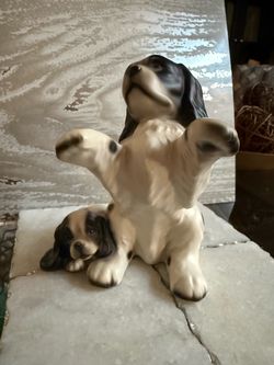 Precious Vintage Ceramic Spaniel Dog and Puppy Figurine   Vintage ceramic figurine depicts a black and white spotted spaniel dog with a puppy. The pie