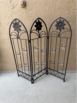 three-panel wrought iron candle screen features flower motifs and 12 removable glass tea light holding