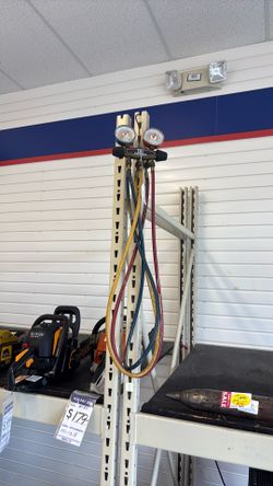 Yellow Jacket Manifold Gauge Set with color-coded hoses for HVAC testing and refrigerant charging