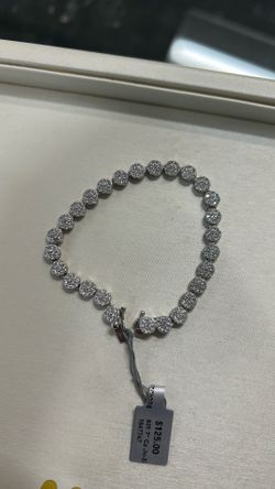 Silver tennis bracelet with cluster style czs