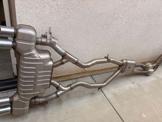 OEM BMW F10 M5 S63 V8 complete rear exhaust / muffler assembly — Eberspächer, quad tip