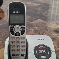 Uniden DECT1560 cordless phone with power cord and phone cord