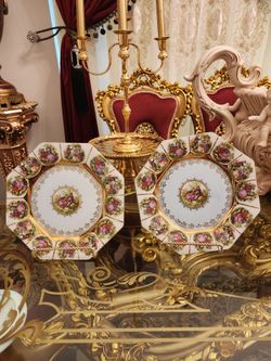 Set of 2 decorative plates  10 inch beautiful in good condition.  No cracks