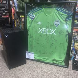 Autographed, Xbox sounders jersey, and Xbox mini fridge