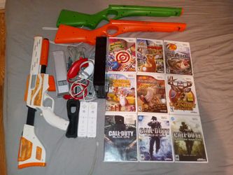 Nintendo Wii with 2 Wii Motes & 2 Nun Chuks 3 Guns 9 Games Located In Edgewater Not In Orlando 