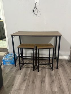 Small table with two stools
