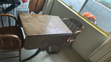 Antique table with four chairs