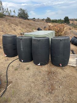 Black Plastic Rain Barrels with Spigots – Set of 4