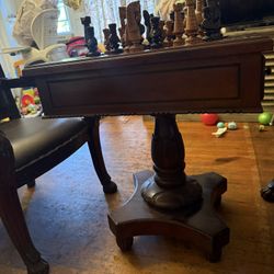 Chess Table With Chairs And Game Pieces 