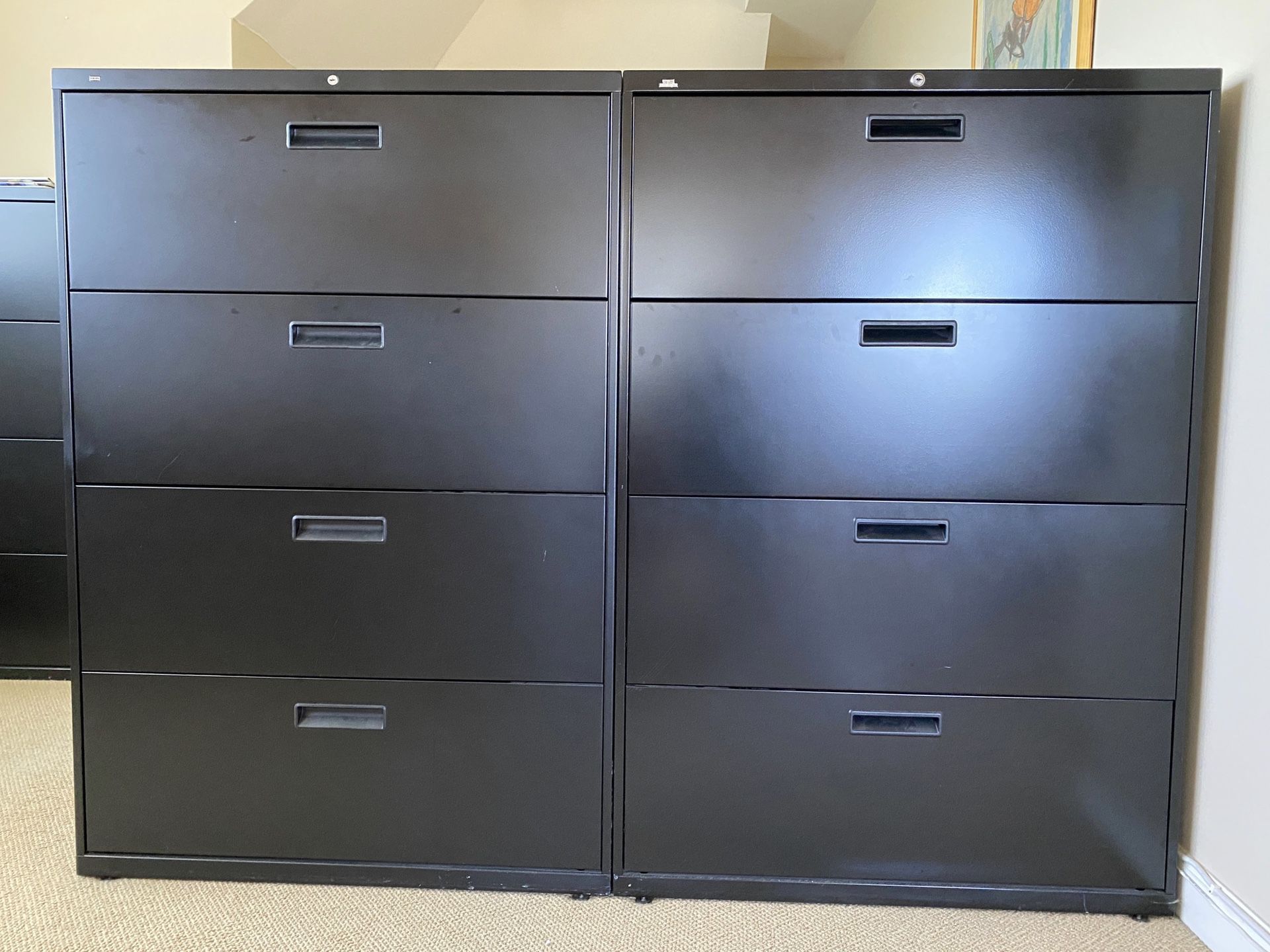 Two HON lateral steel file cabinets with 4 locking drawers