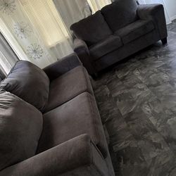 Two piece grey love seat and couch