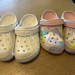 Two Pairs of Kids Crocs Classic Clogs