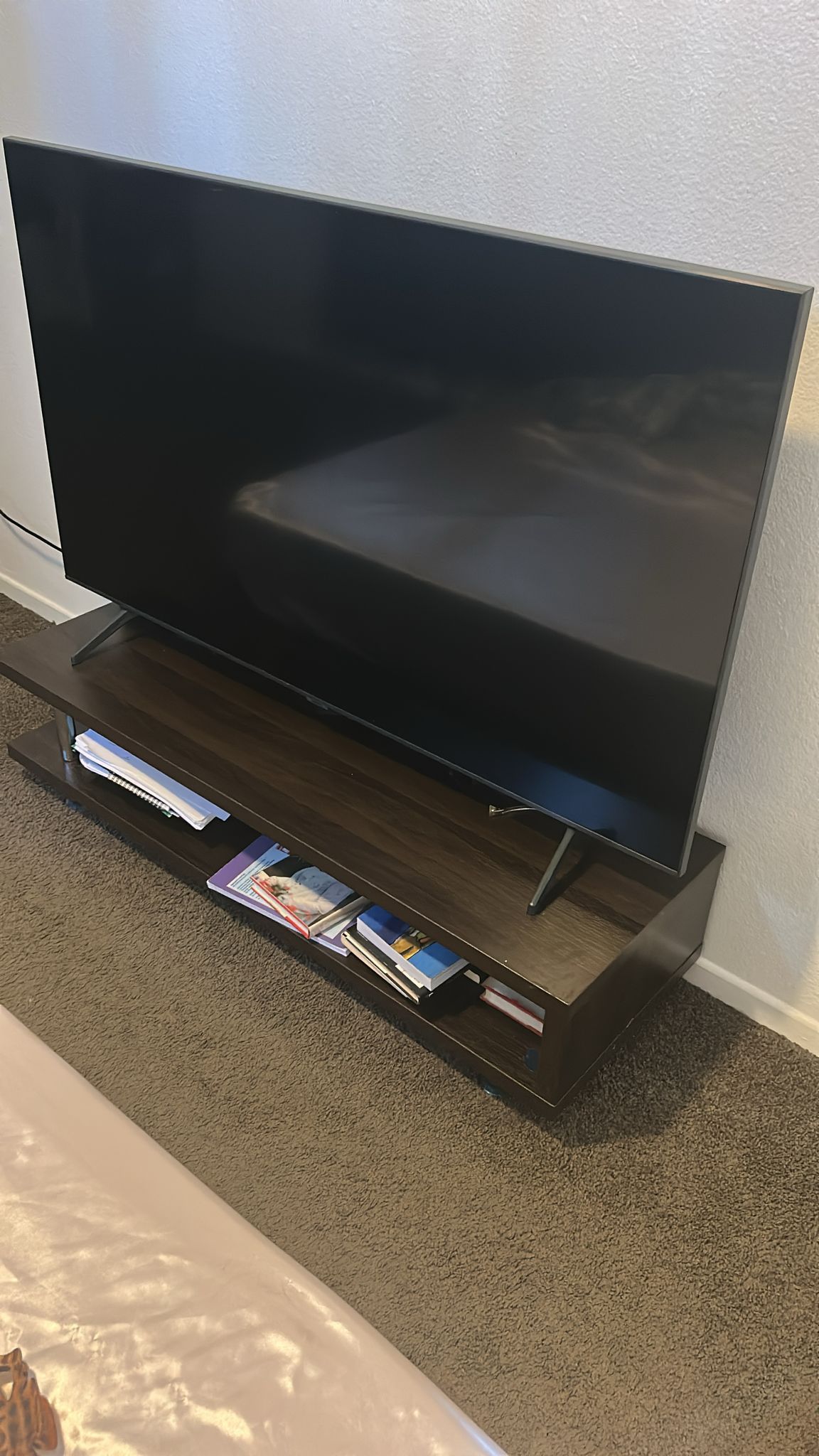 Samsung TV and brown furniture.