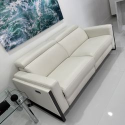 Atlas White Leather/Vinyl Power Reclining Sofa Loveseat Excellent Condition. Adjustable Headrest / Footrest. Dimensions: 63W x 33H x 43.5L. Was $2,400