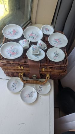 wicker picnic basket and vintage porcelain miniature tea pieces
