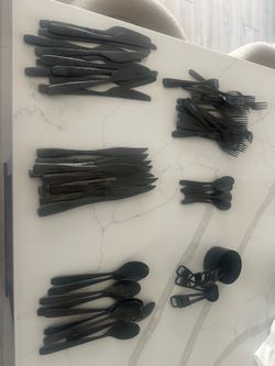 Black silverware and measuring utensils