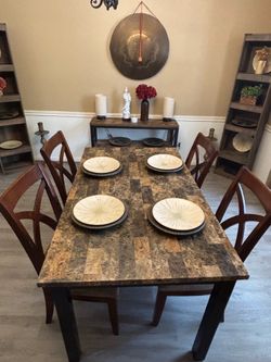 Dining table with faux marble top