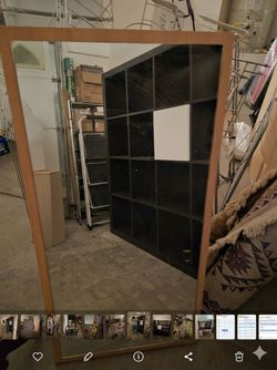 Wooden frame wall mirror.