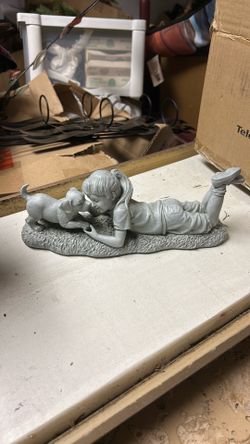 Child and dog statue