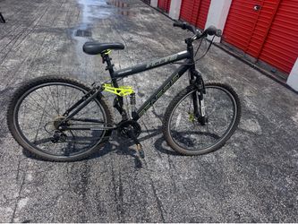 Genesis Incline mountain bike with a black frame and distinctive yellow accent 56