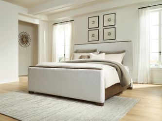 Radkin Burnished Brown King Upholstered Panel Bed