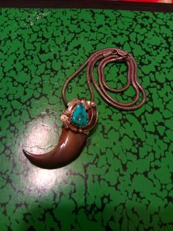 Turquoise and bear claw pendant