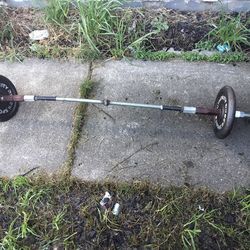 Bar with 50 pounds total on it. Two 25s on each side (MAKE ME AN OFFER IM NOT FIRM ON PRICE!
