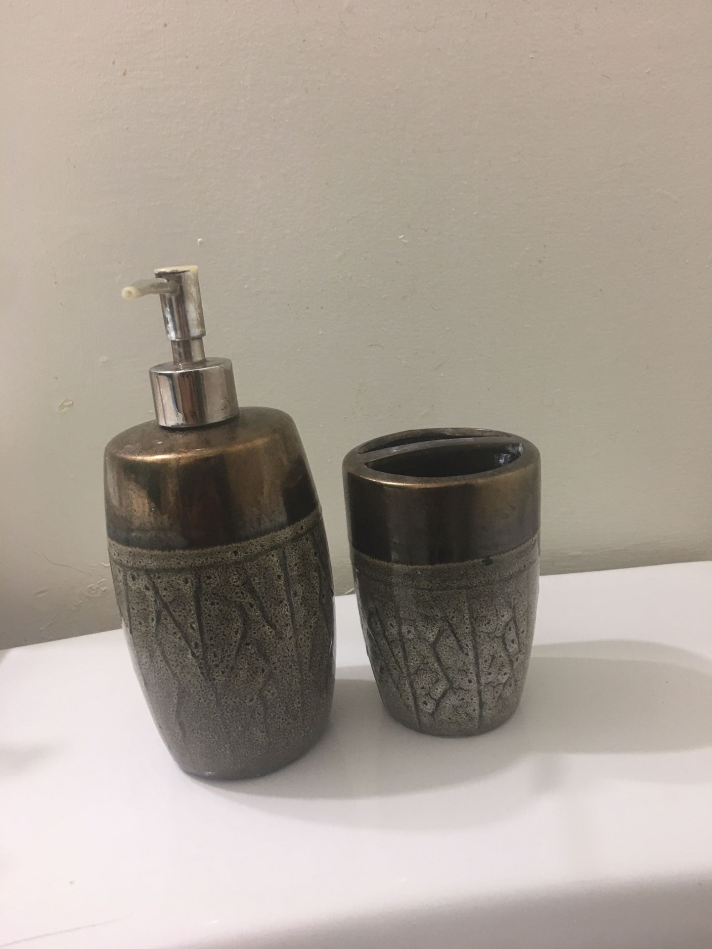 Tooth brush holder and soap dispenser