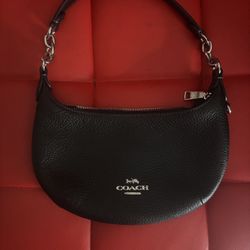 Coach Mini Payton hobo bag, crafted from black refined pebble leather with silver-tone hardware. 
