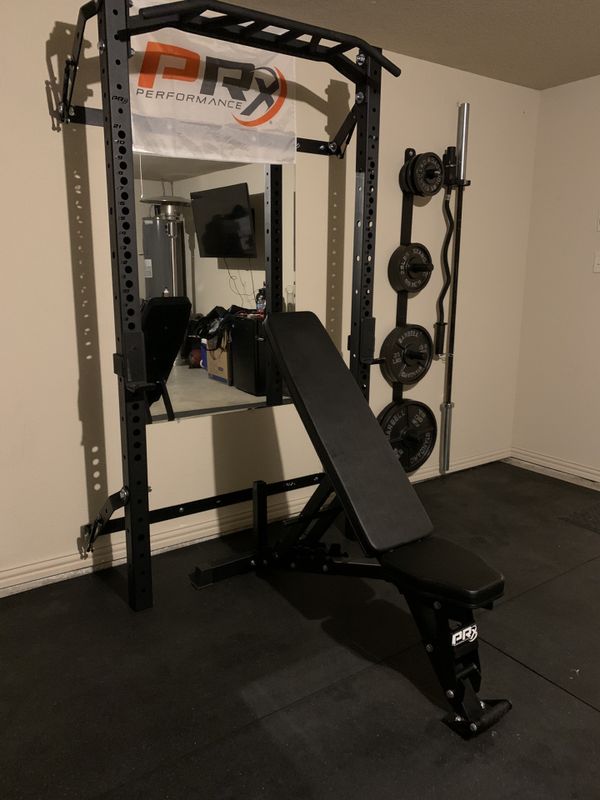 Prx Pro Squat Rack with Multigrip Bar and weights for Sale in Burleson