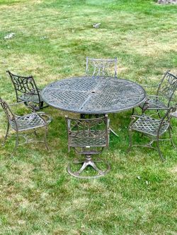 High end patio set, cost over $5000 new, 60” patio table with 6 chairs, 2 of them swivel, delivery available for extra cost