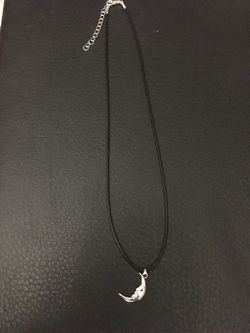 Silver Moon Charm On A Necklace 