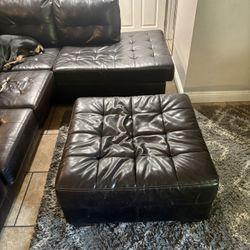 Black Leather Sectional And Ottoman 