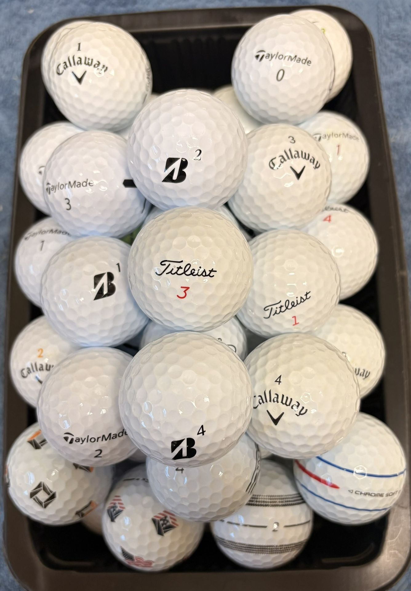 50 Golf Balls As Pictured Titleist , Taylormade, Callaway….