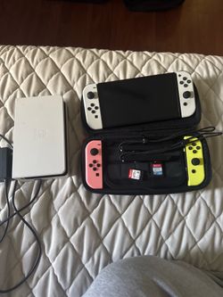 Nintendo Switch OLED with 4 controllers.  Smash bros and Nintendo Switch Sports + Case and Dock