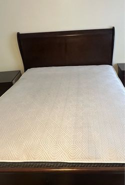 Bed ,dark brown ,queen size  and it has 2 light stands