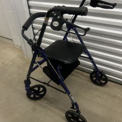 Drive Medical blue rollator walker with a padded seat and storage pouch.