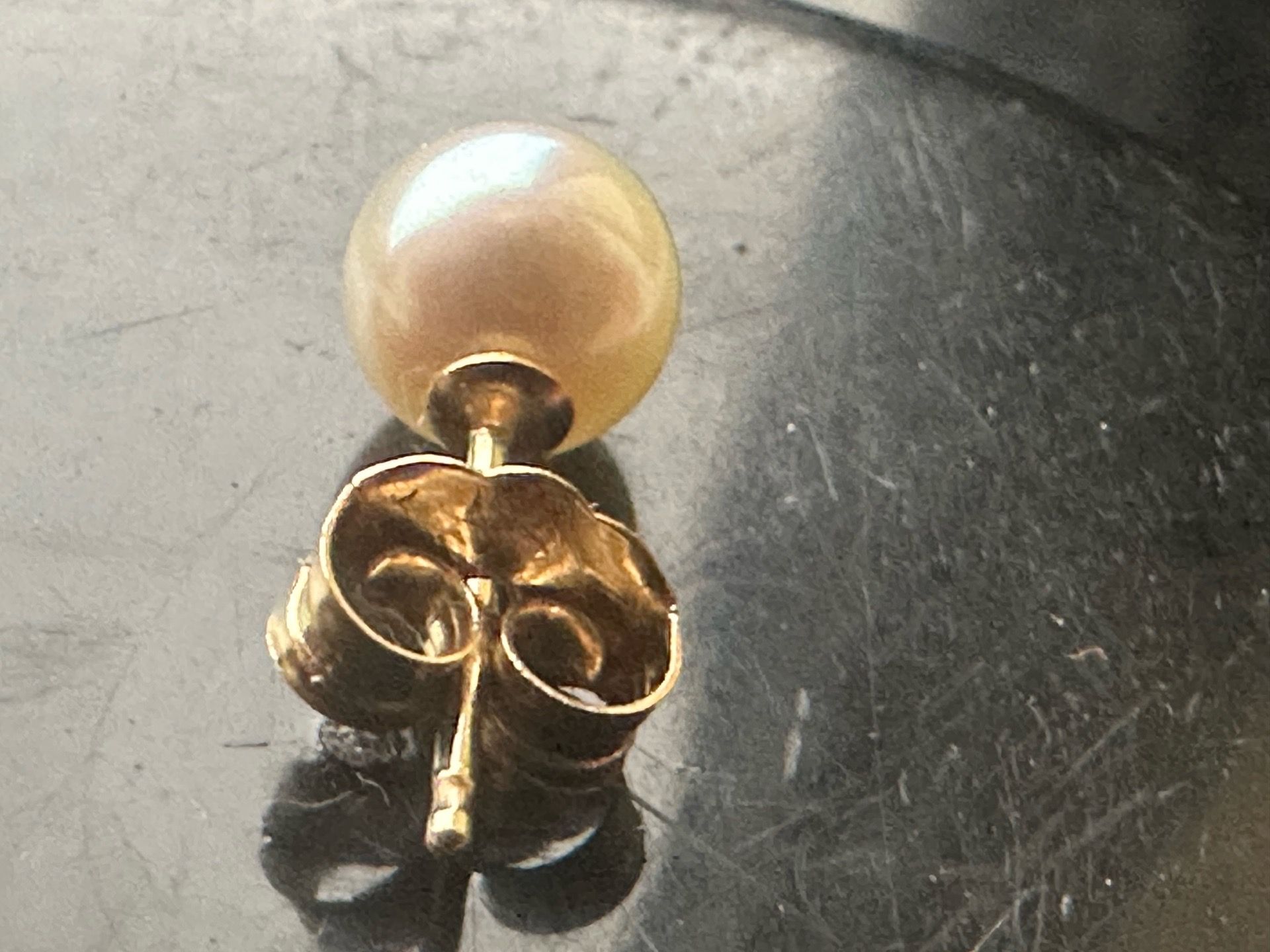 One pearl with 14 karat post