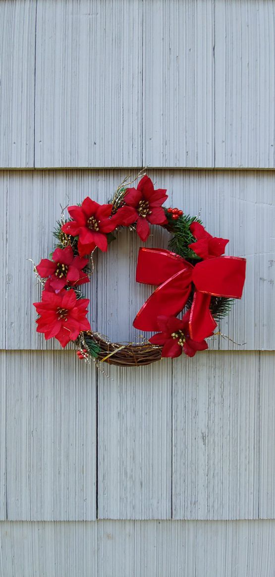 Christmas wreaths done in red silk flowers