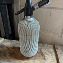 Vintage Soda Siphon Glass Seltzer Bottle with Mesh Cover.