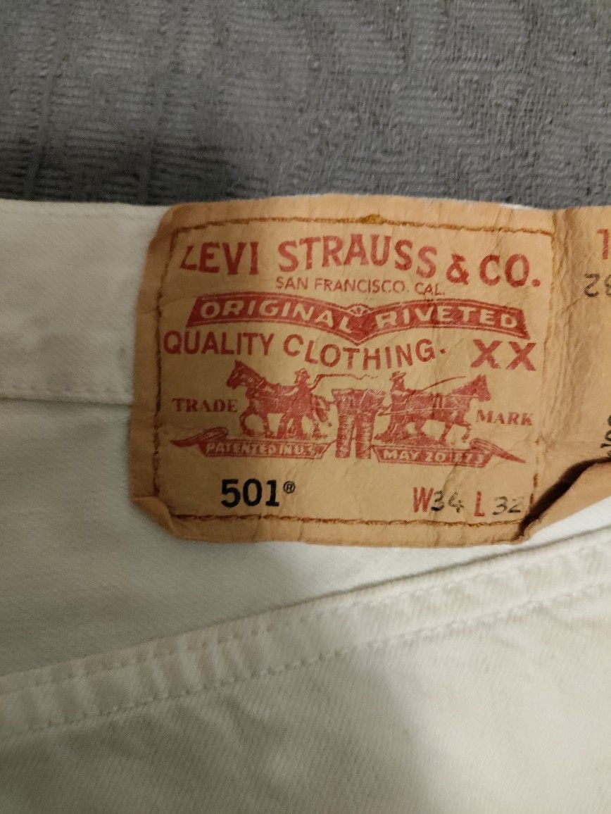 White Levi Red Tags, 34W, 32"L. Rivets.